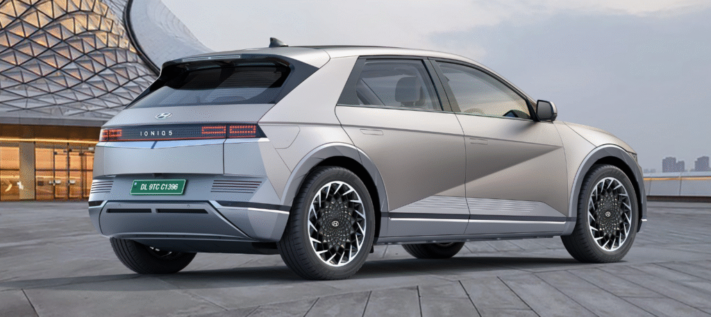 Rear view of Hyundai Ioniq 5 in India, showcasing its modern pixel LED taillights, aerodynamic design, and alloy wheels in an urban setting.