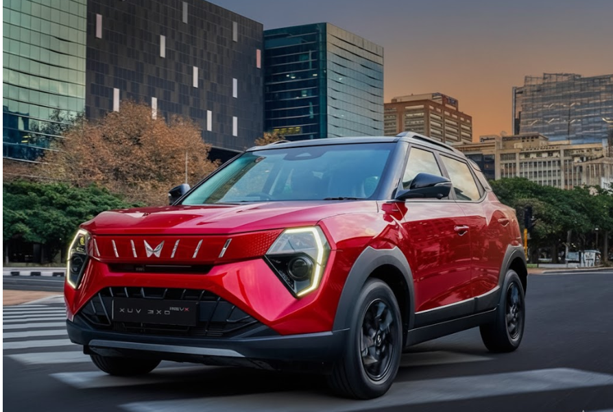 Mahindra XUV 3XO RevX in red seen from the front in an urban city environment