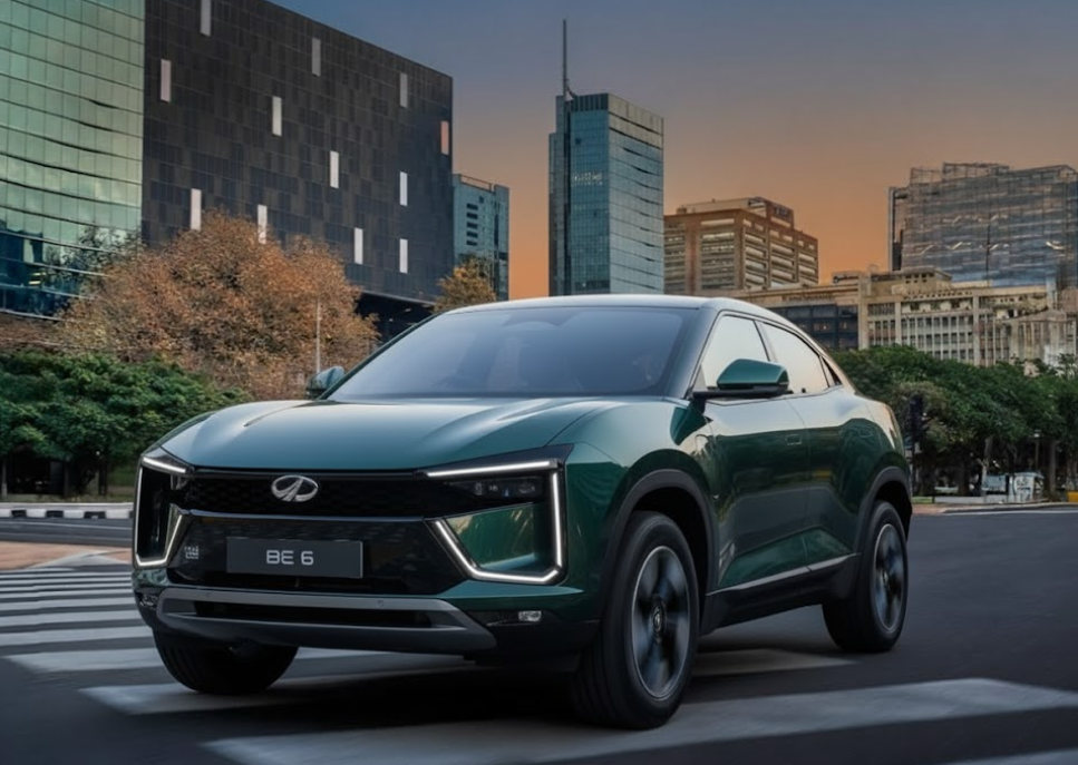 Mahindra BE6 Pack Two electric SUV on city road with modern buildings in the background
