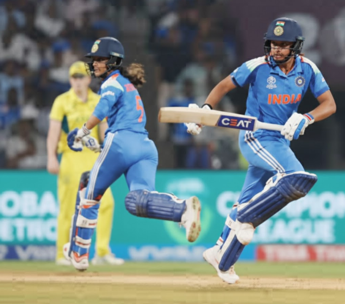 Harmanpreet Kaur and Jemimah Rodrigues run between the wickets during the ICC Women’s World Cup 2025 Semi Final against Australia Women.