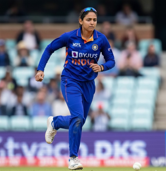 Harmanpreet Kaur in action during the ICC Women’s Cricket World Cup 2025, representing India in full blue kit while fielding on the ground.