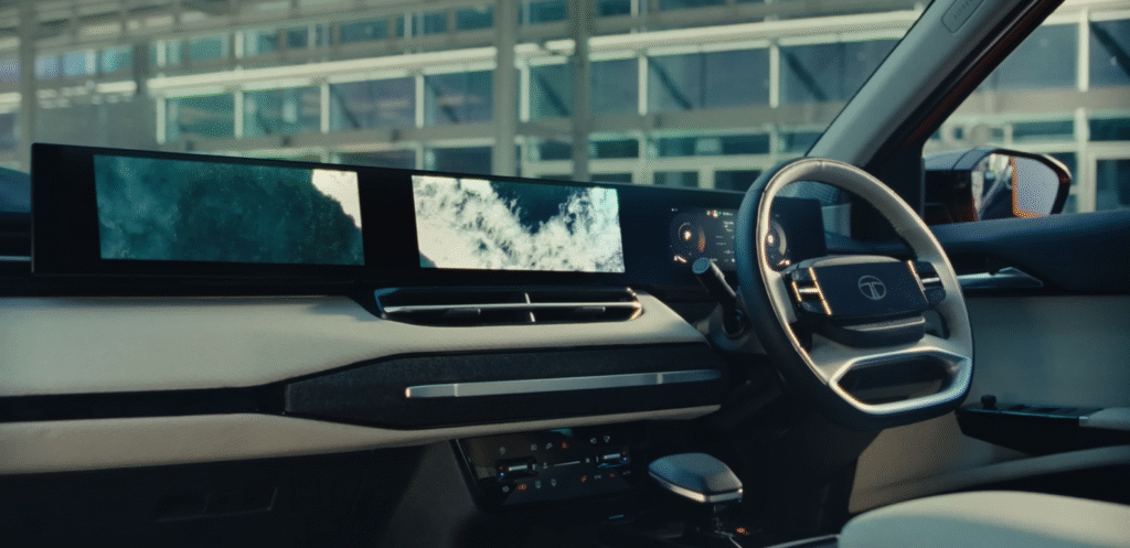 Tata Sierra 2025 interior featuring a triple-screen dashboard, digital instrument cluster, modern steering wheel, and premium cabin design.