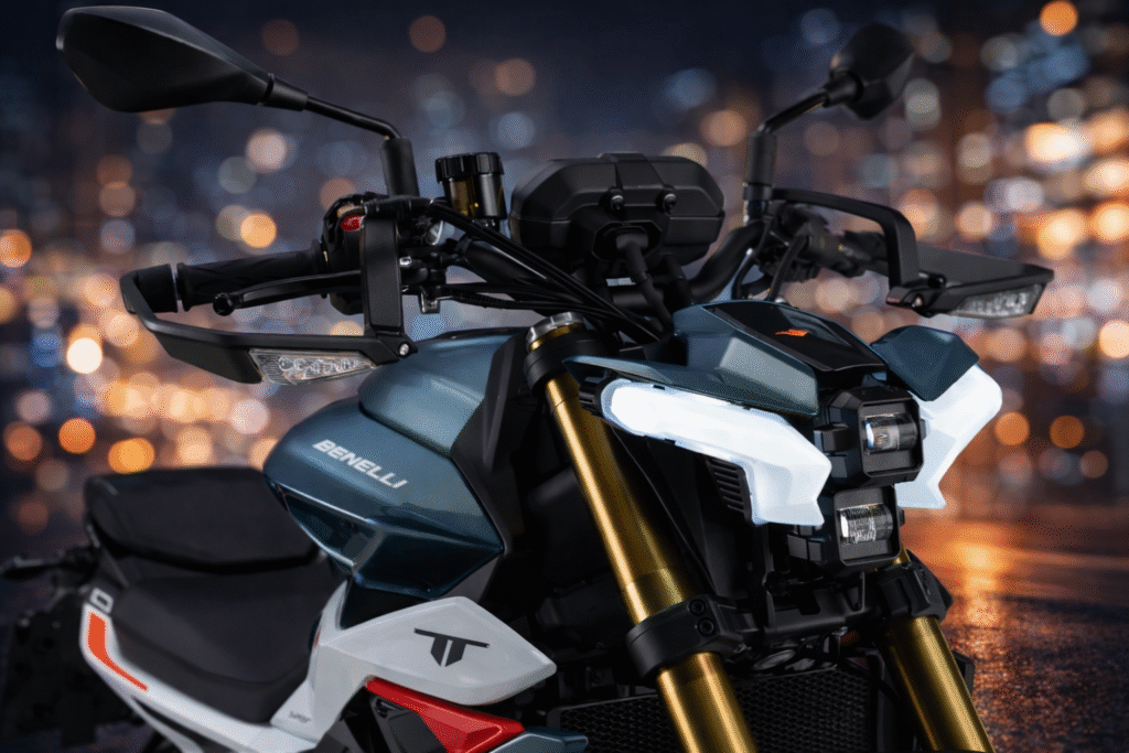 Close-up front view of Benelli TNT 550 showing sharp LED headlamp, gold USD front forks, wide handlebars, and aggressive naked bike design at night