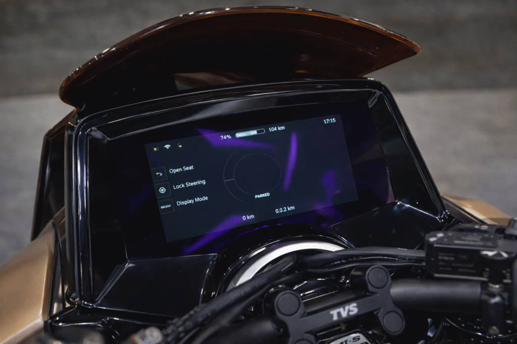 TVS M1-S digital instrument cluster showing TFT display with battery status and smart controls