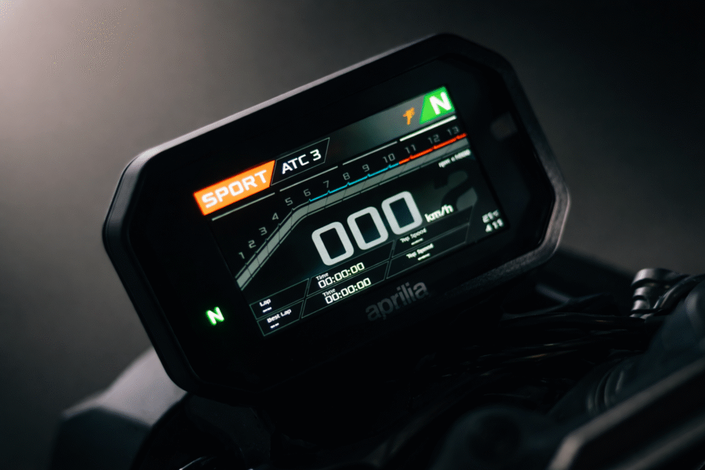 Aprilia Tuono 457 TFT digital instrument cluster showing Sport mode, ATC level, speedometer and gear indicator