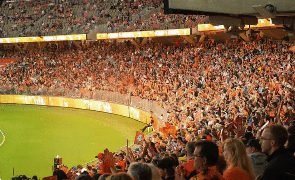Big Bash League crowd celebrating in a packed stadium, showcasing fan-first atmosphere and T20 cricket excitement